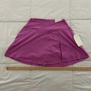 Blogilates Womens Crisscross Slit Skort First Bloom Size L pockets Gymwear NWT